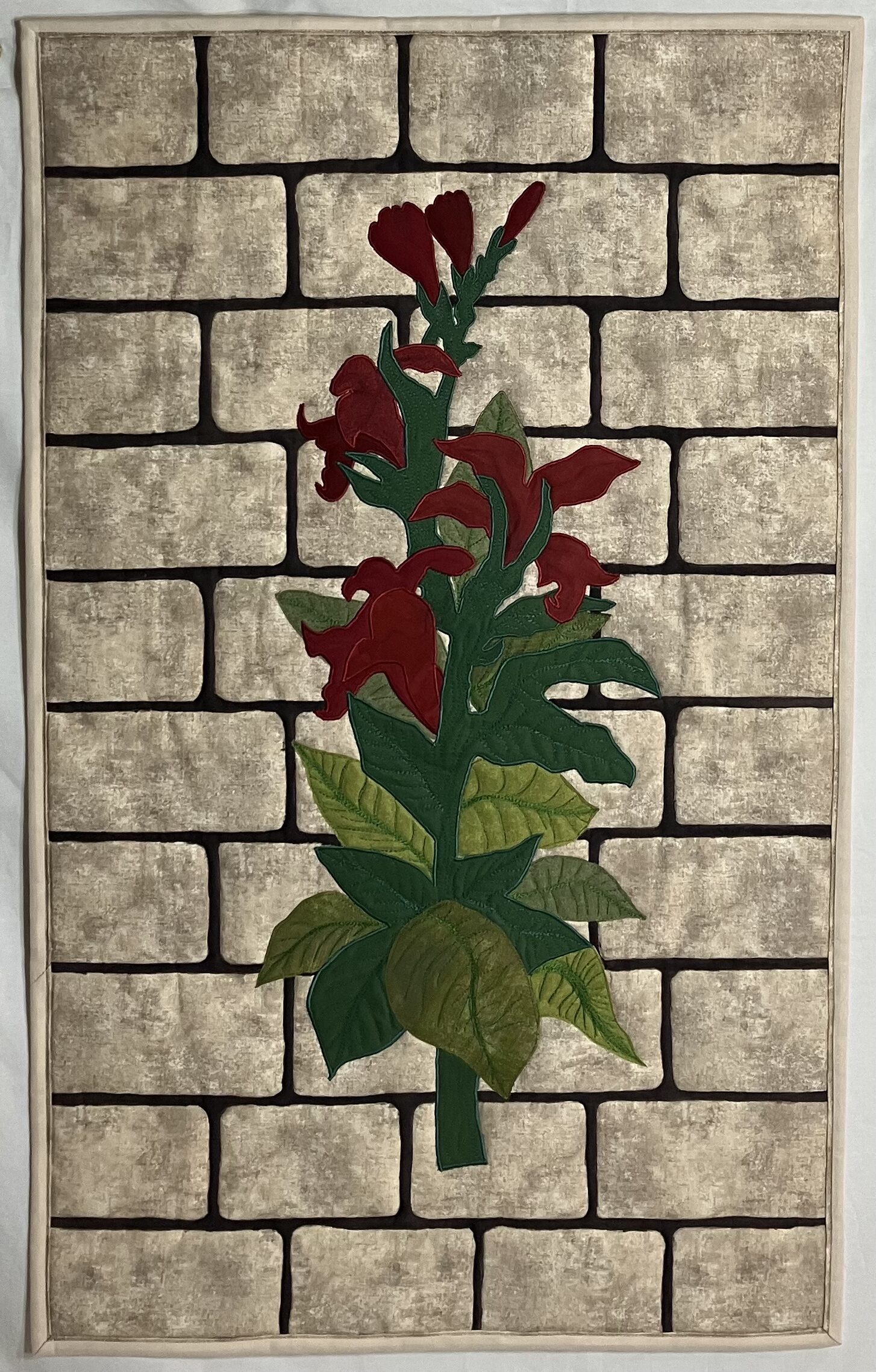 Red Cana on Brick Wall